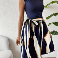 Lucy – stylish patchwork dress with belt and striped print